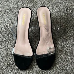 Size 8.5 clear heels. Worn a handful of times but we’ll taken care of.